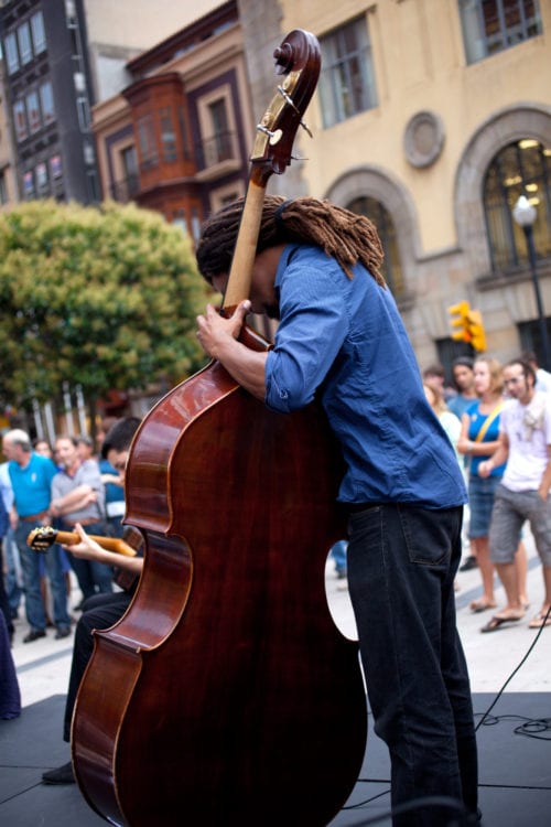 Classical upright bassist performs on the street, Hartford, CT